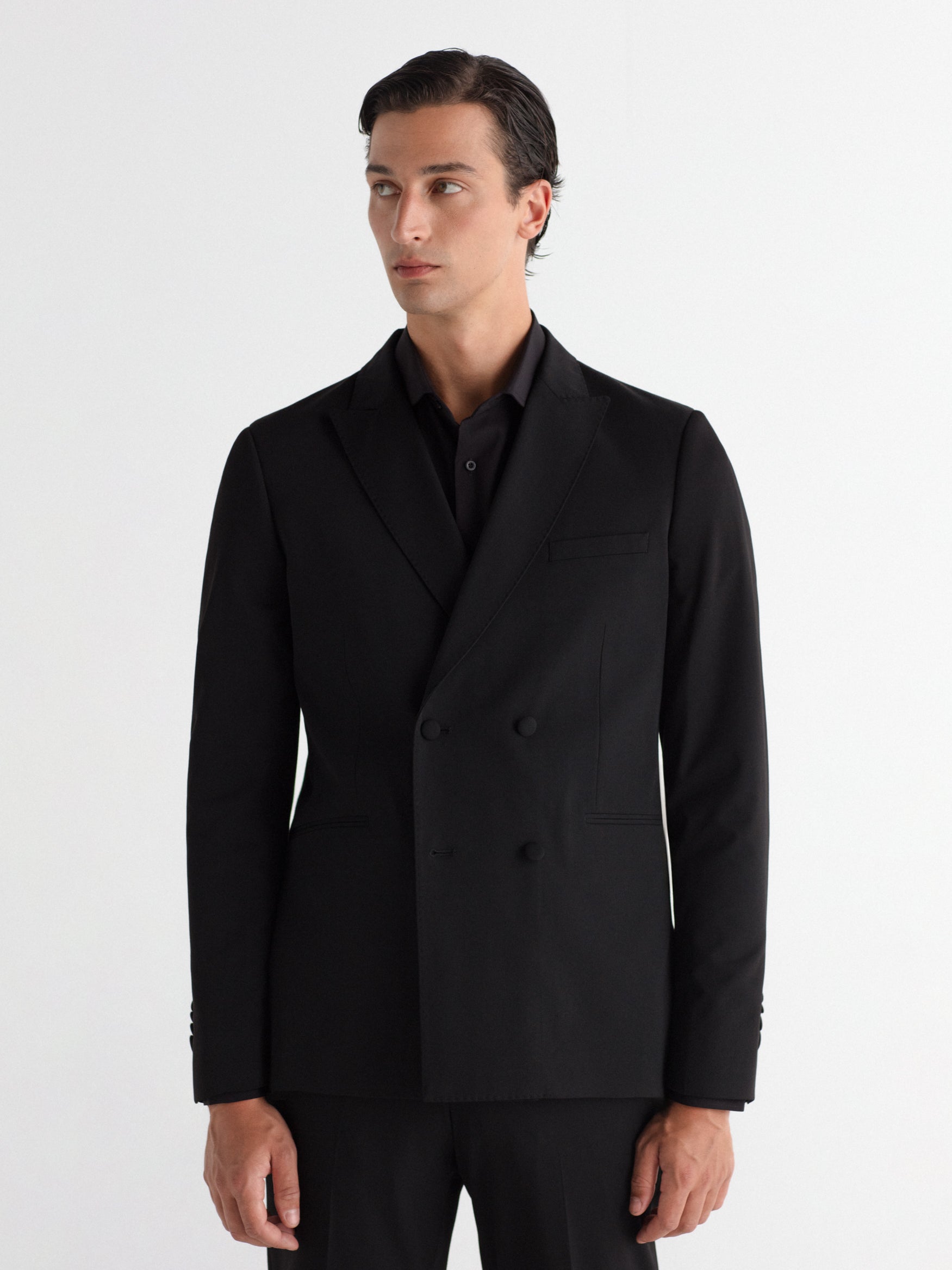 Double-breasted, slim-fit, gala-style suit jacket.