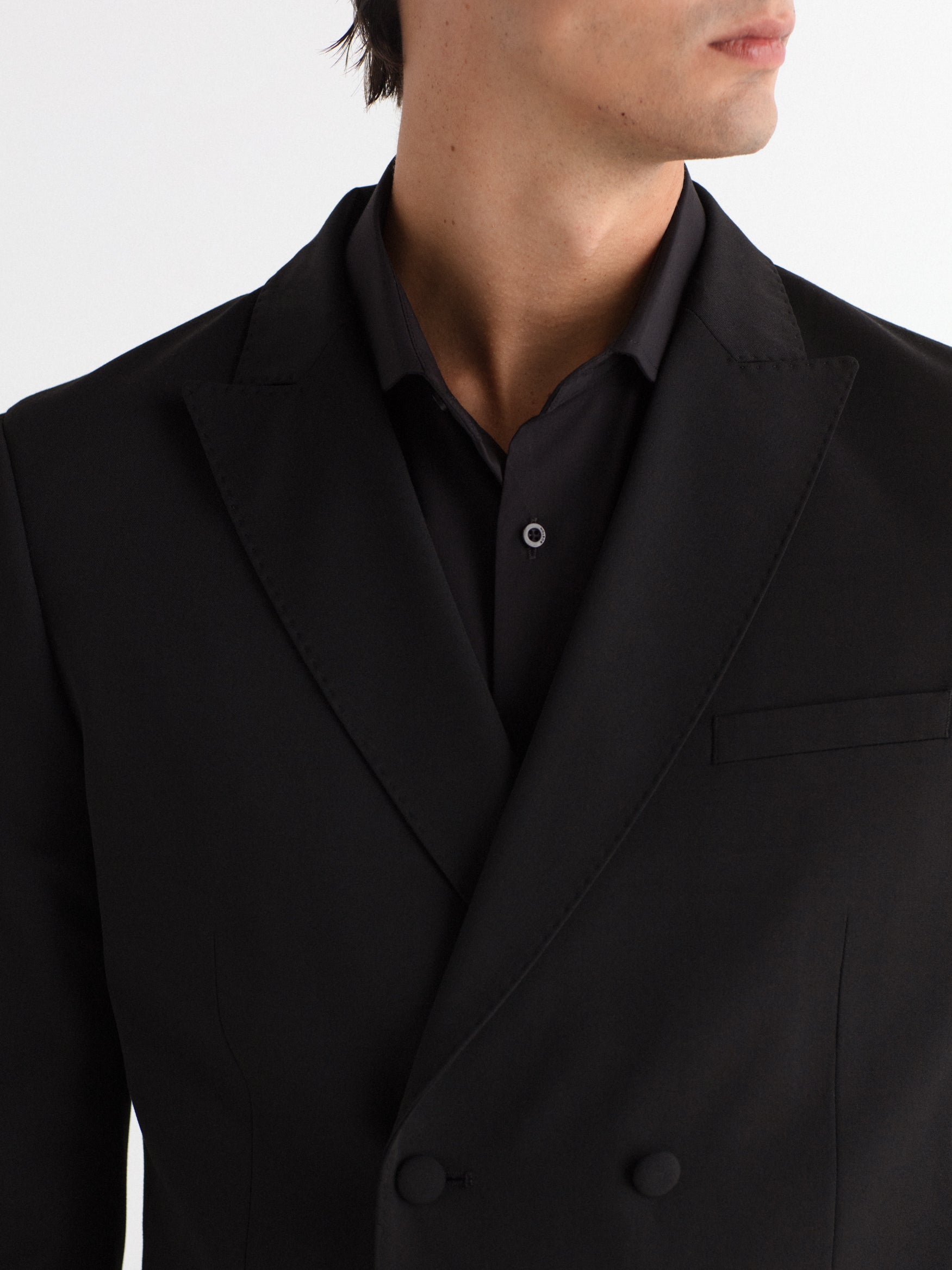 Double-breasted, slim-fit, gala-style suit jacket.