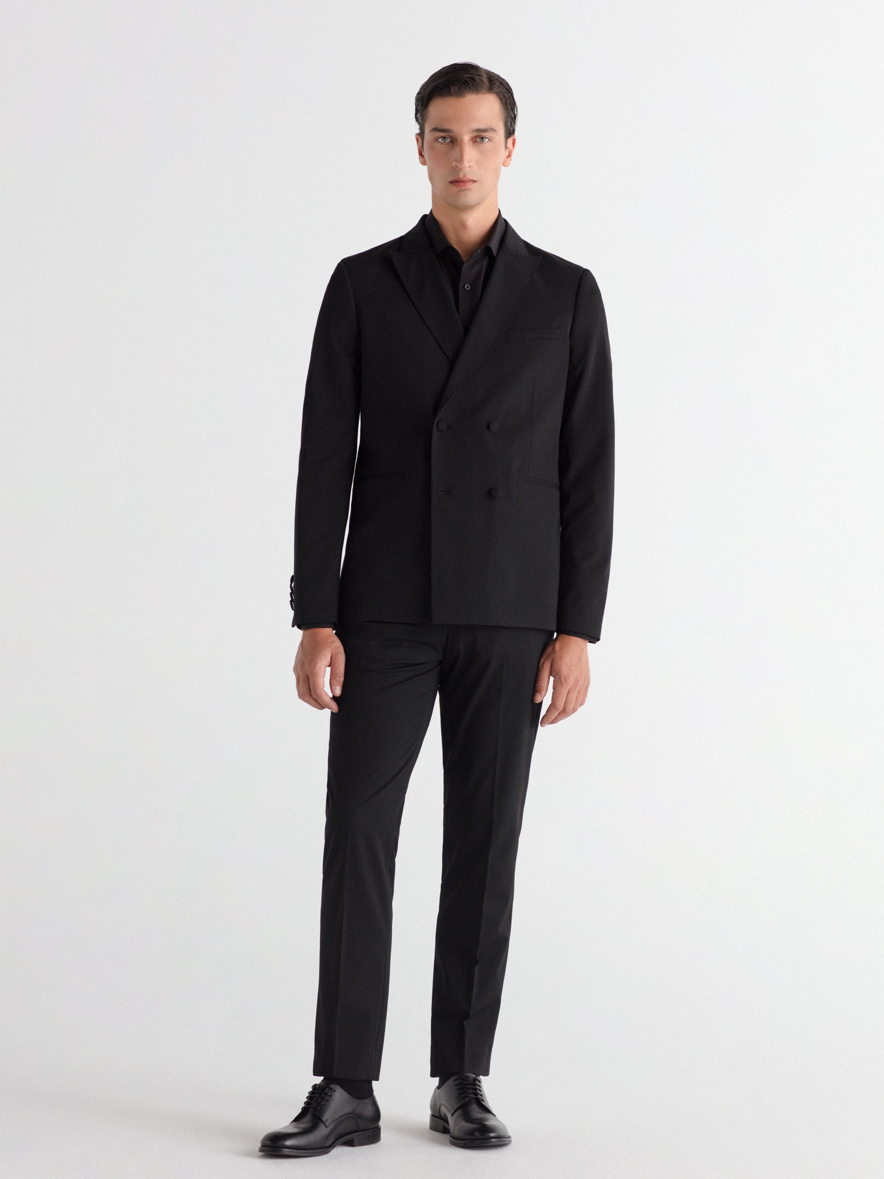 Double-breasted, slim-fit, gala-style suit jacket.