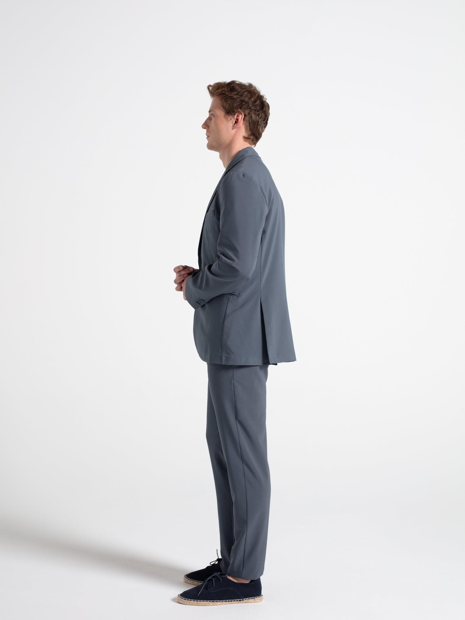 Technical fabric trousers with a checkered pattern and pleats.