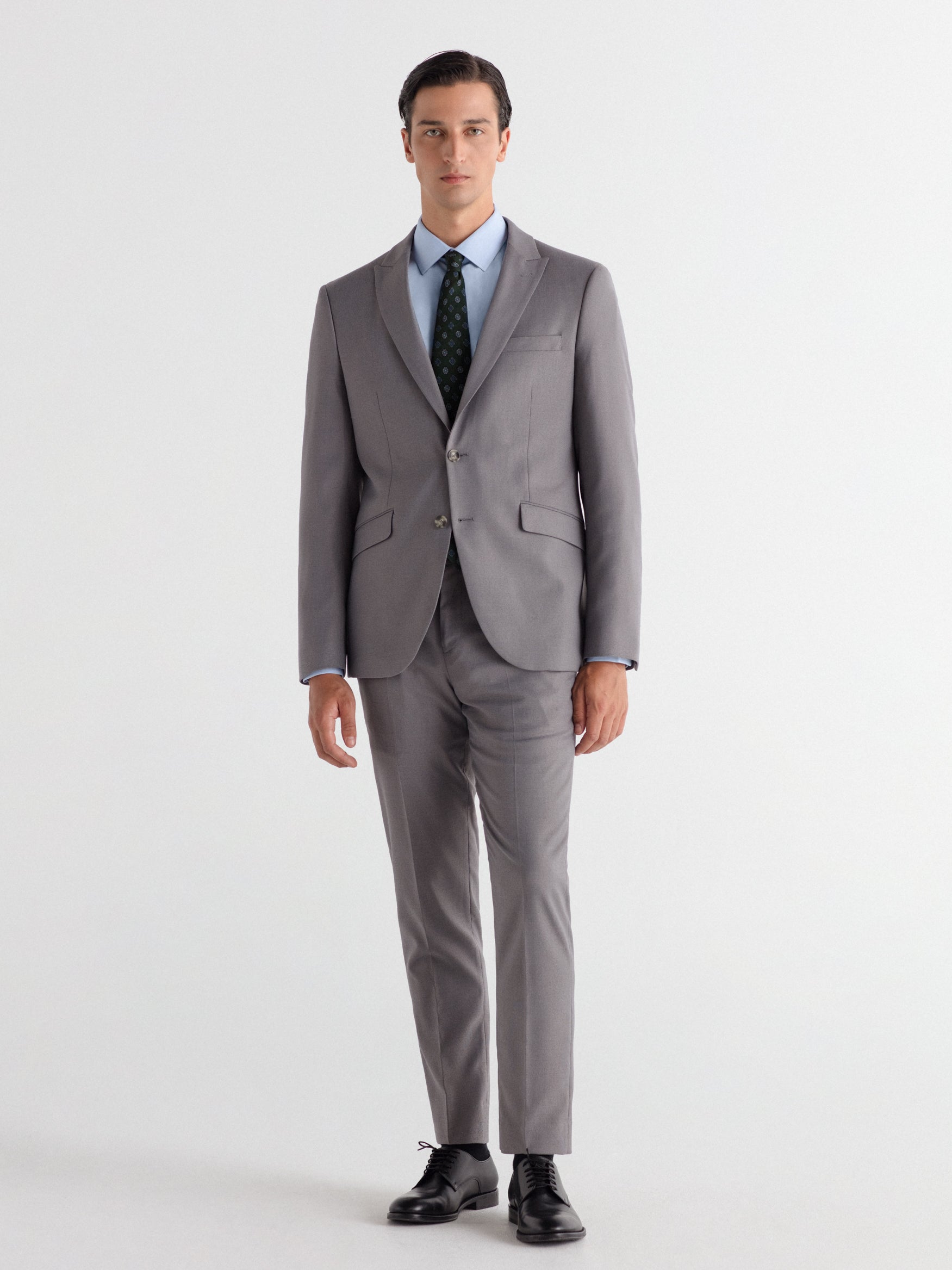 Pantalón traje slim fit falso liso