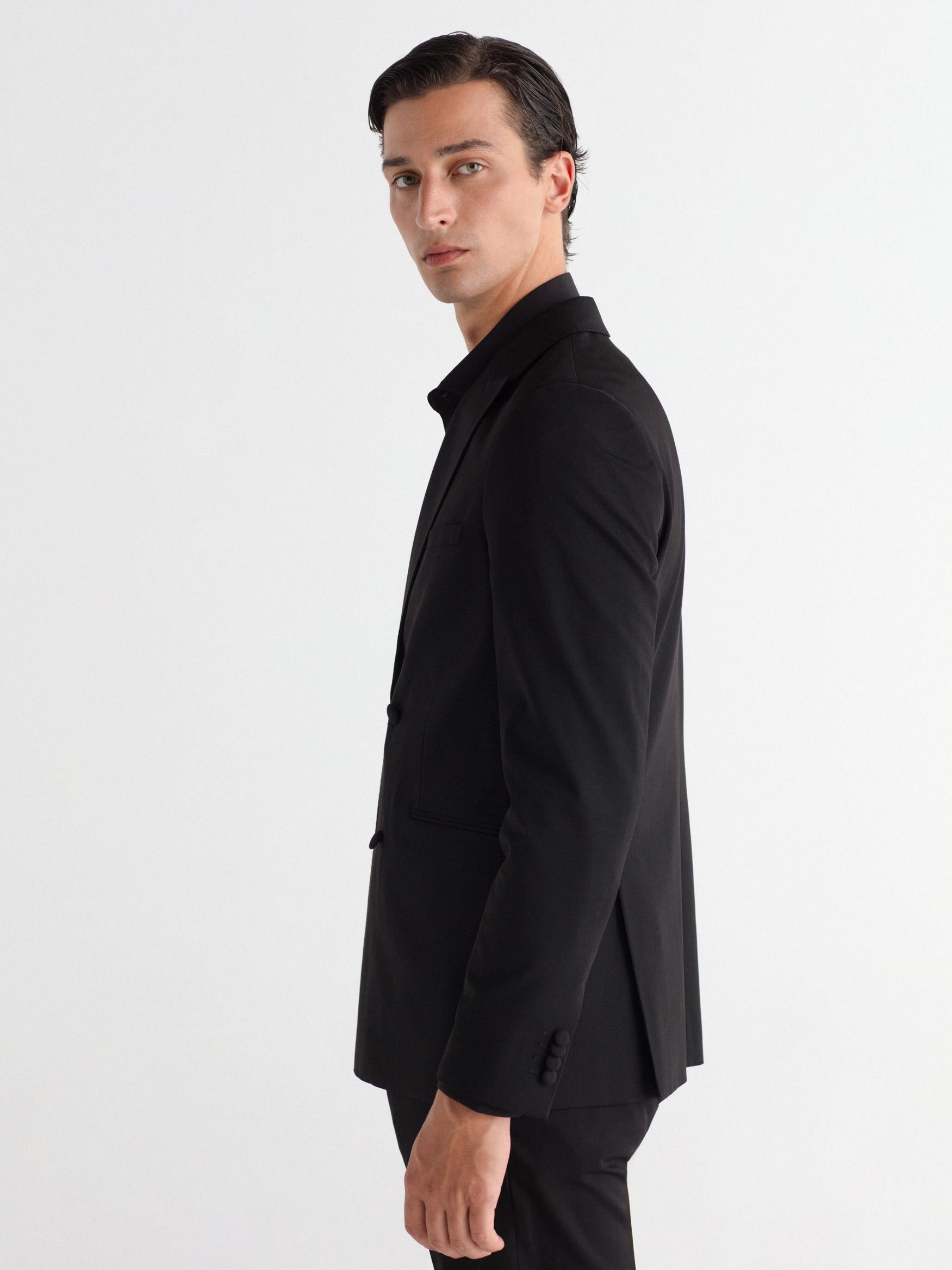 Double-breasted, slim-fit, gala-style suit jacket.