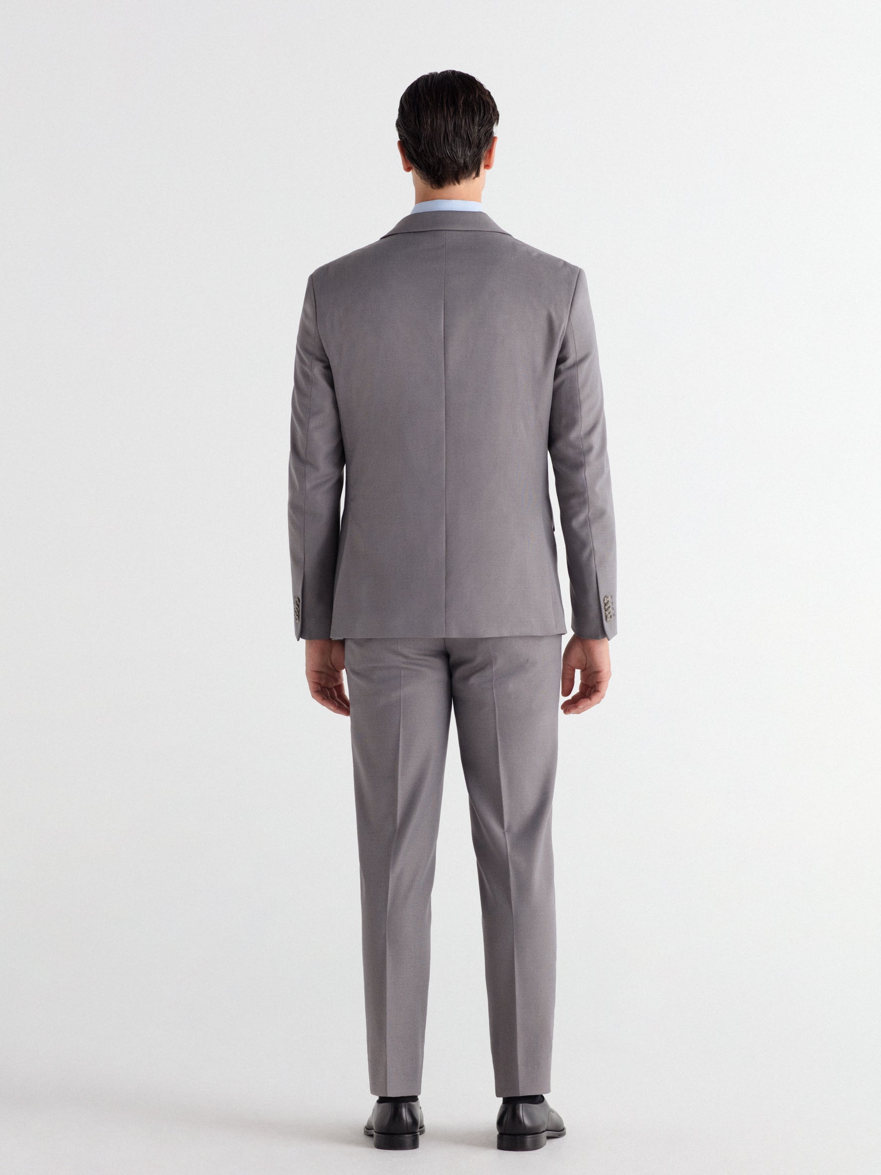 Pantalón traje slim fit falso liso