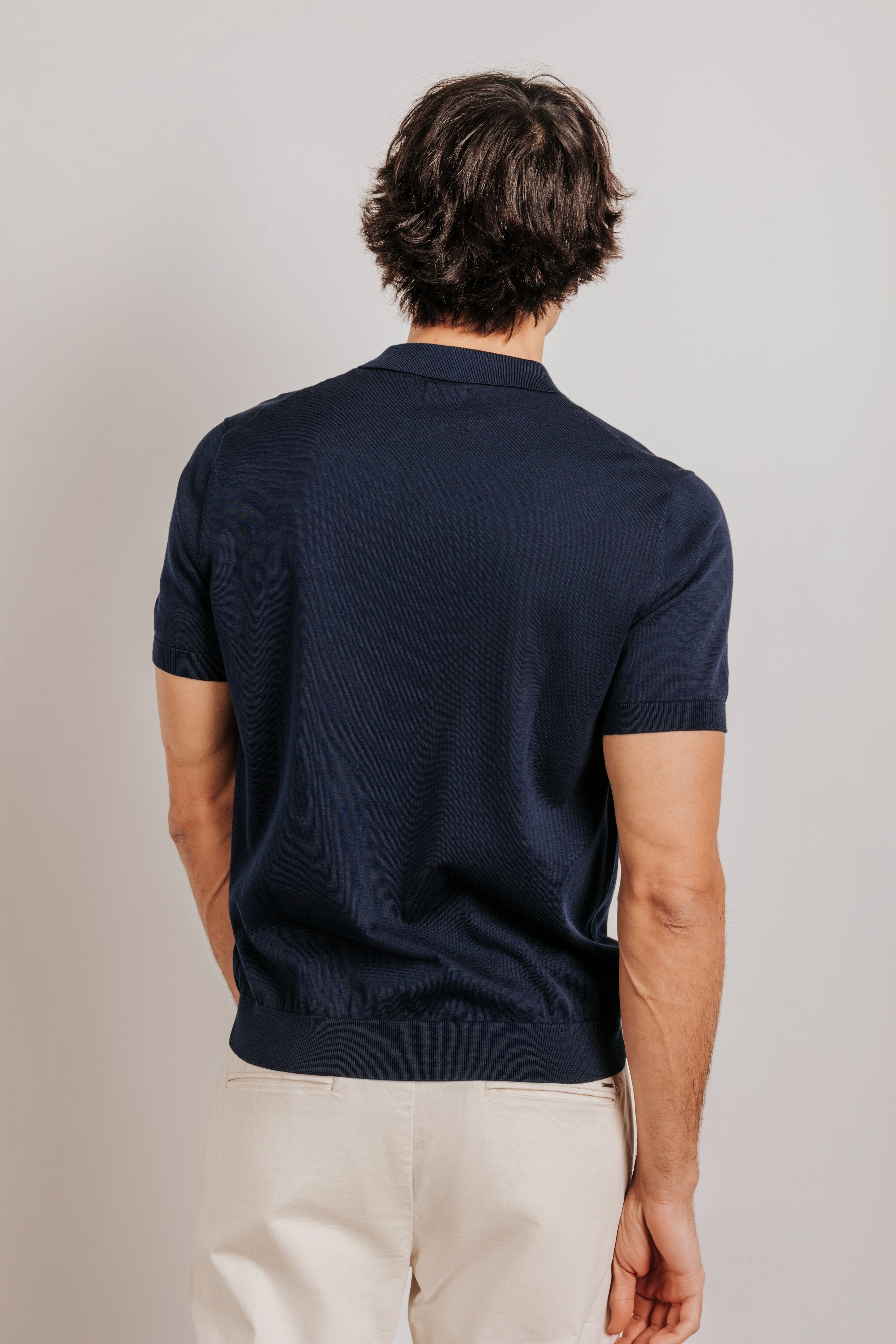 Buttonless knit polo shirt