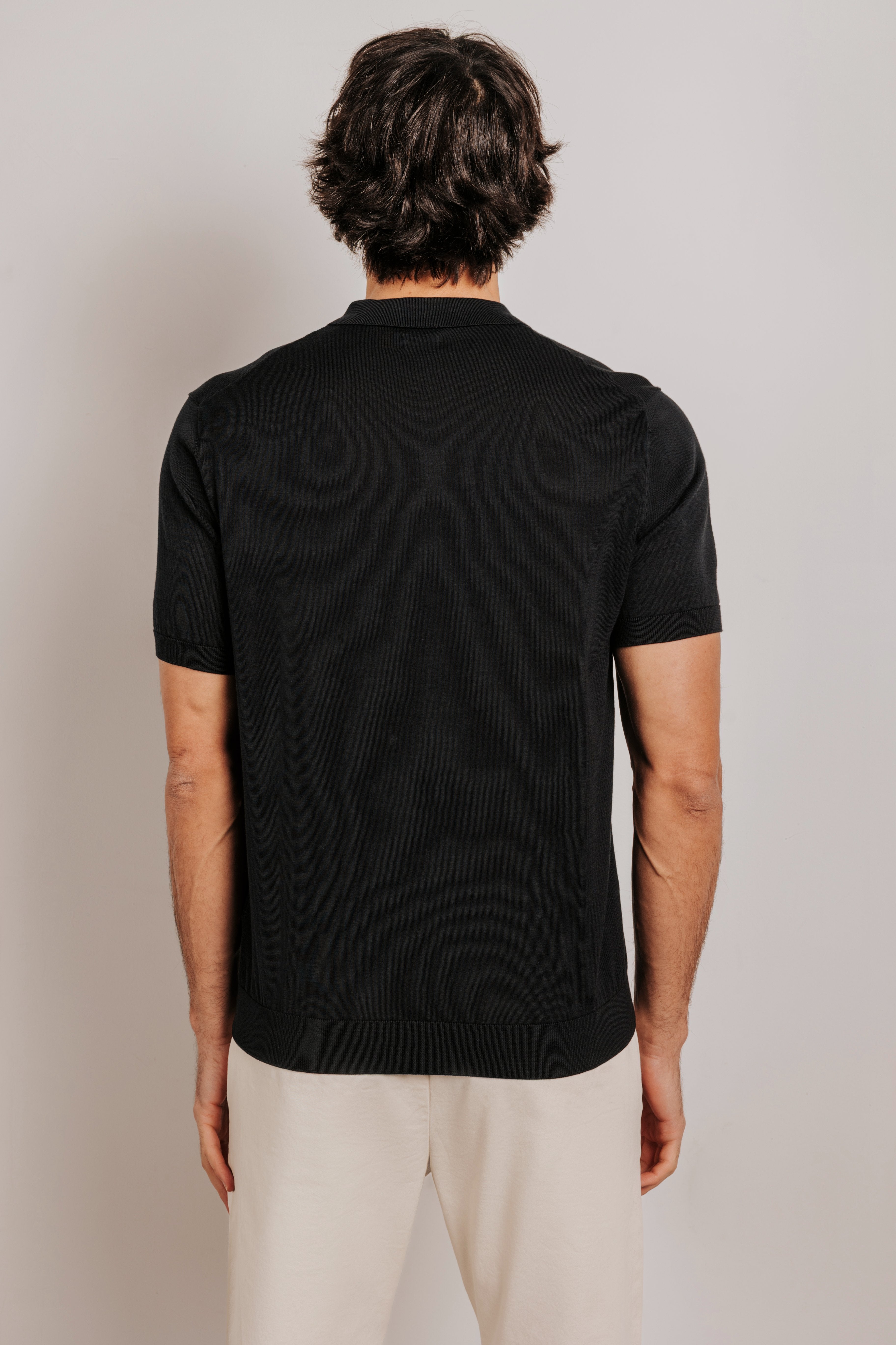 Buttonless knit polo shirt