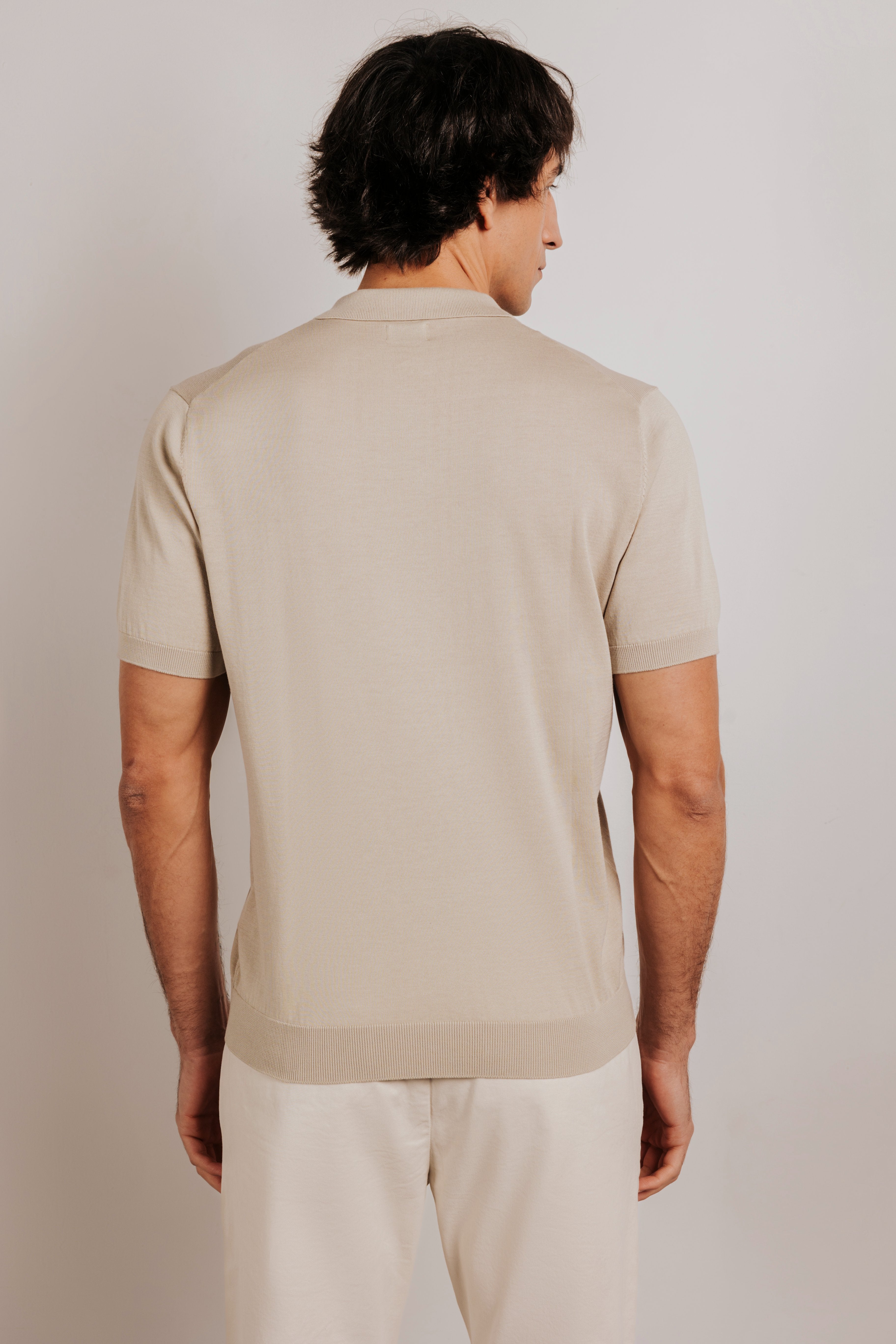 Buttonless knit polo shirt