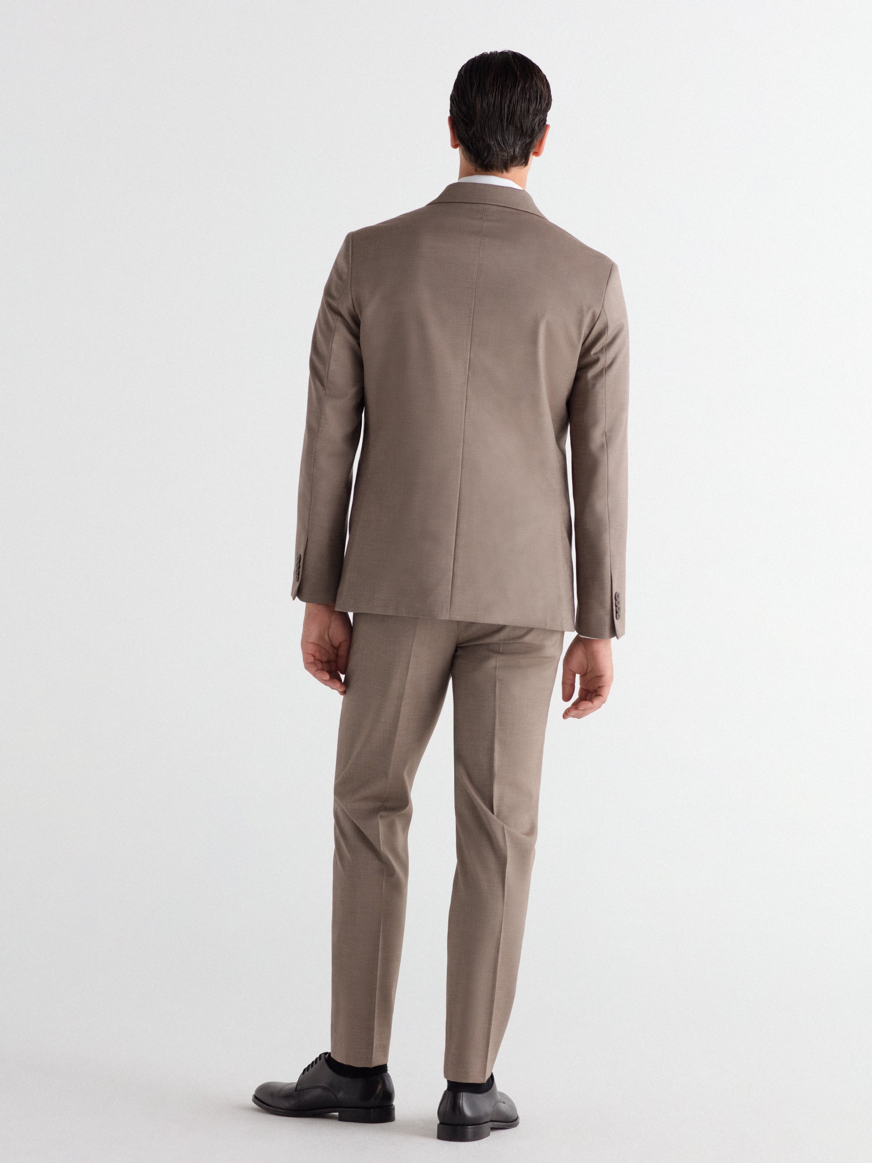 Pantalón traje slim fit falso liso