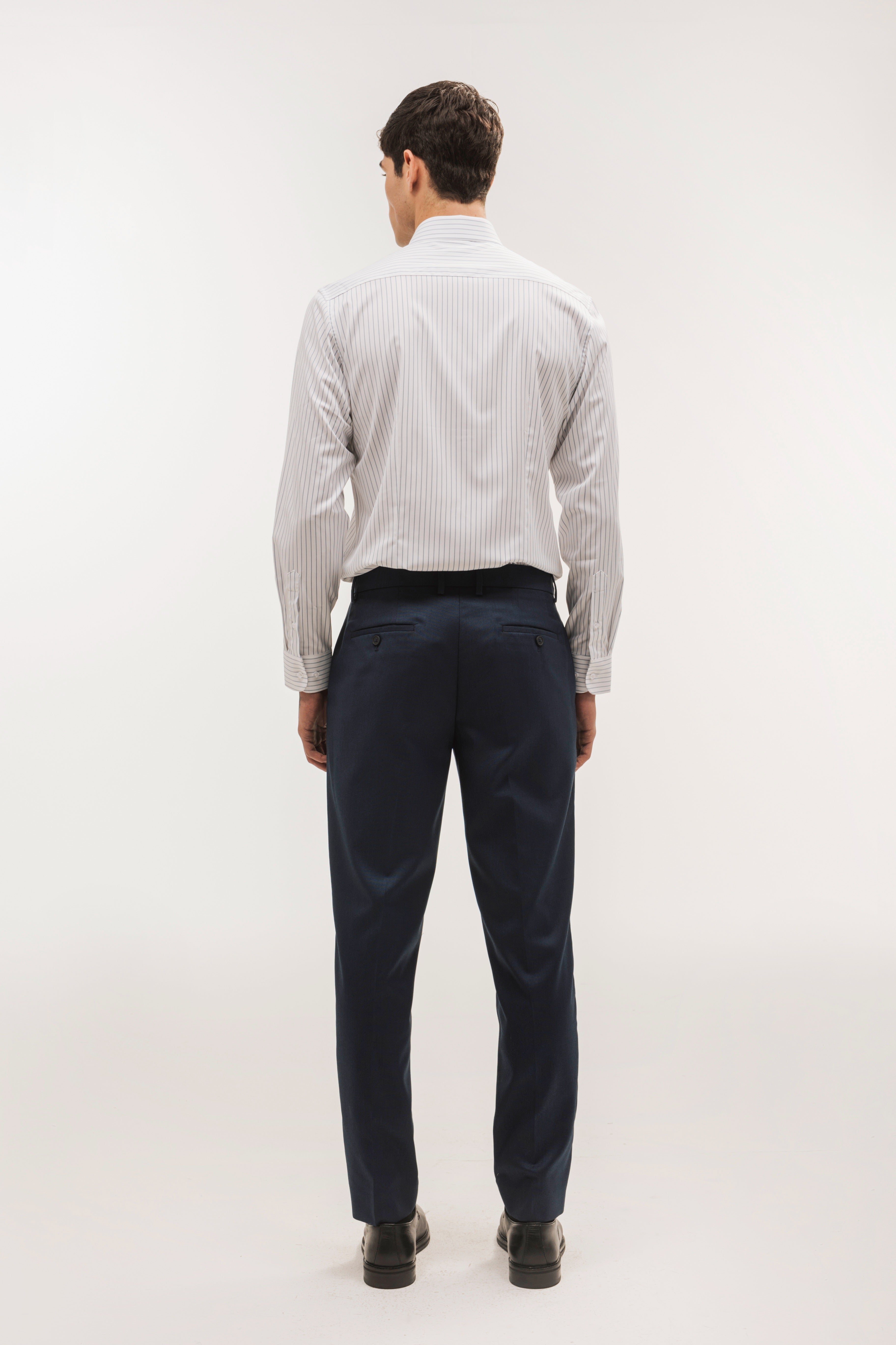 Pantalón traje slim fit falso liso