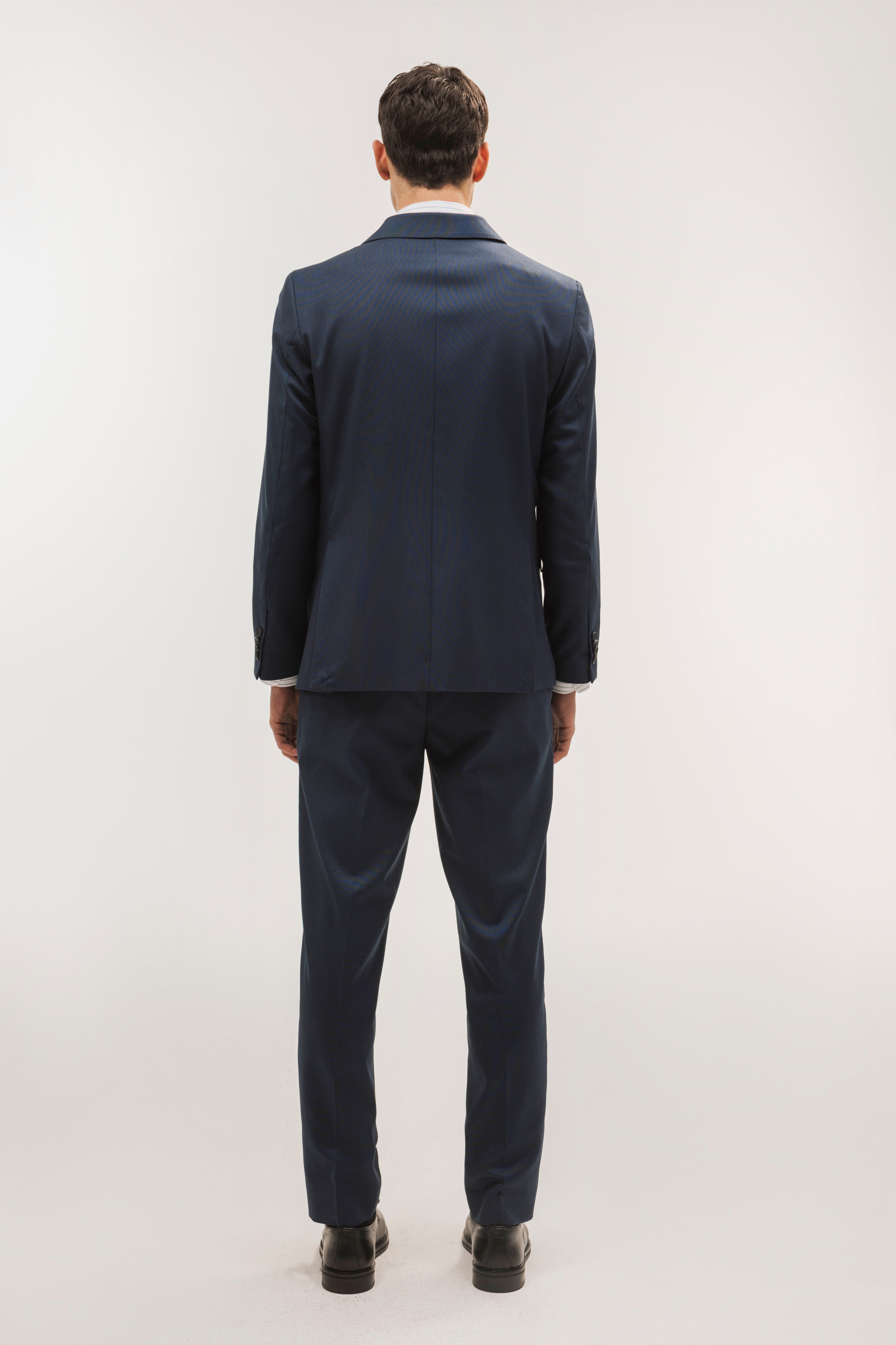 Pantalón traje slim fit falso liso