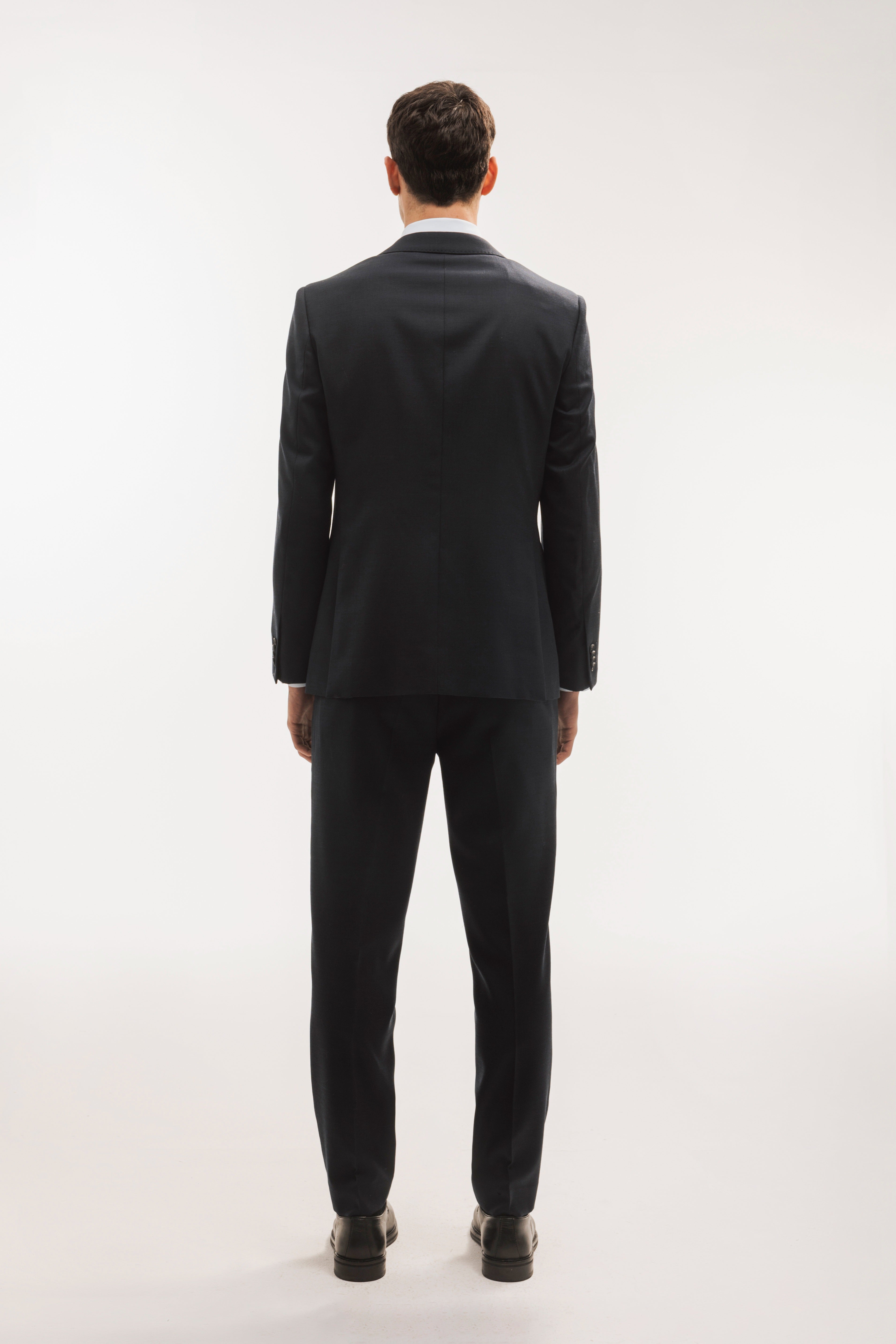 Pantalón traje lana slim fit falso liso