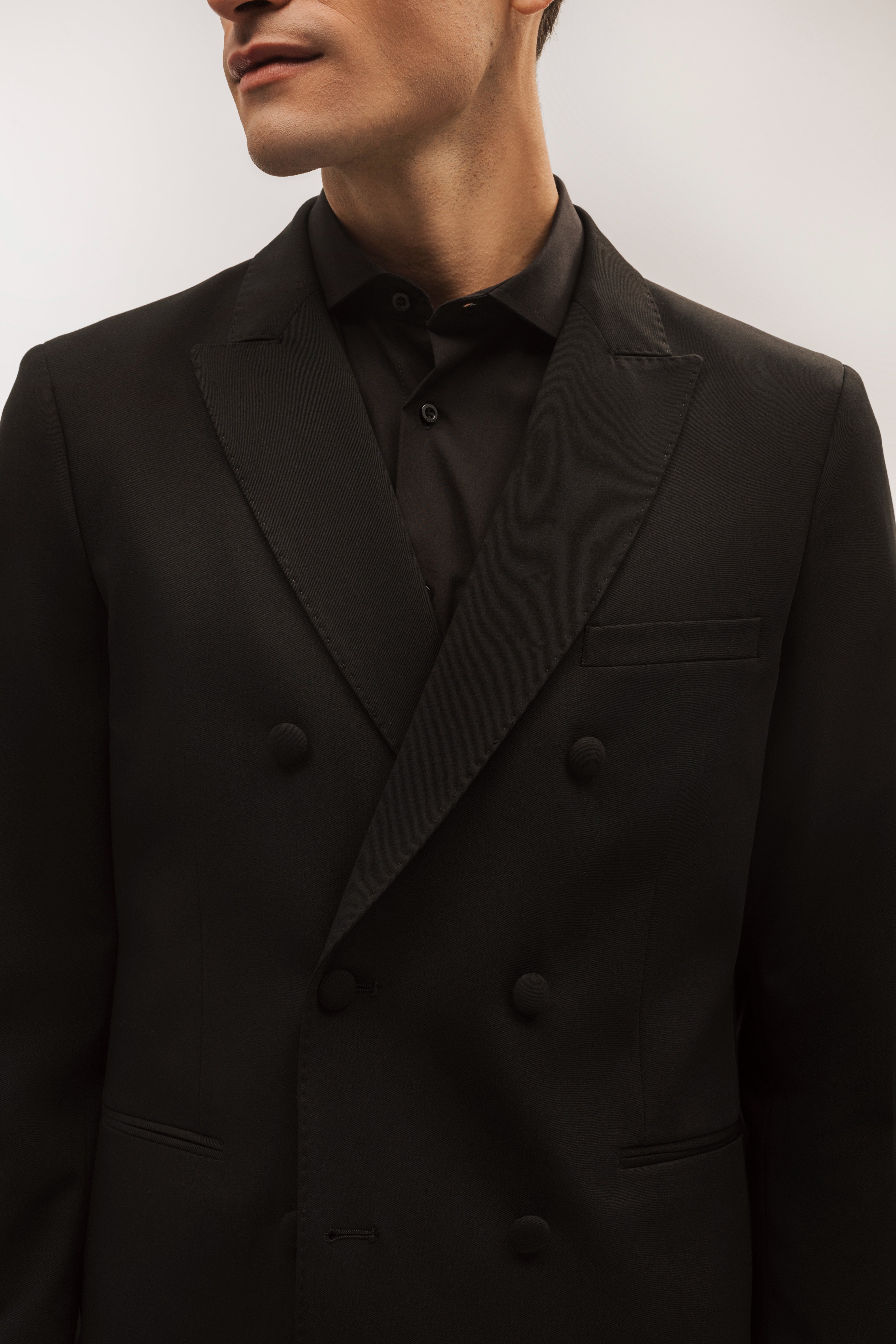 Double-breasted, slim-fit, gala-style suit jacket.