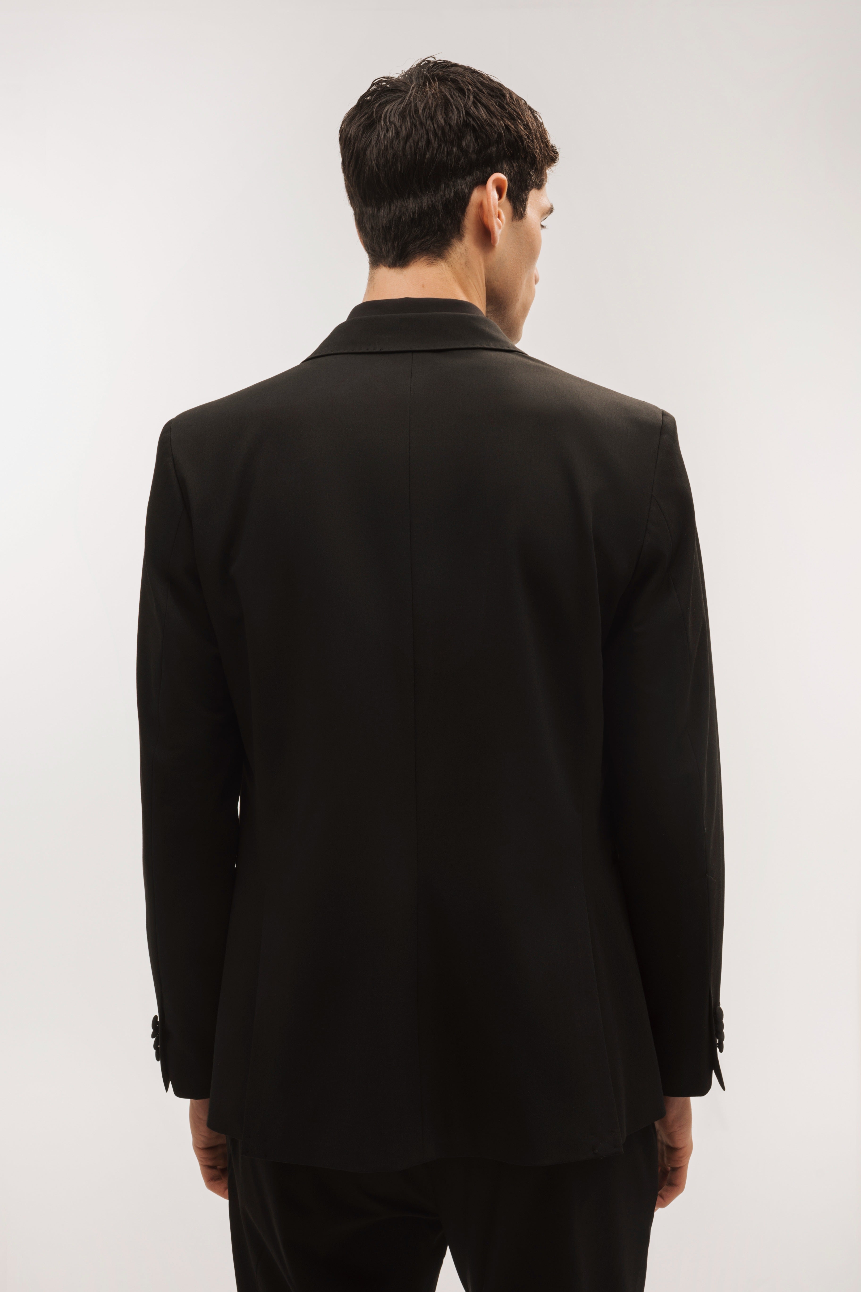 Double-breasted, slim-fit, gala-style suit jacket.