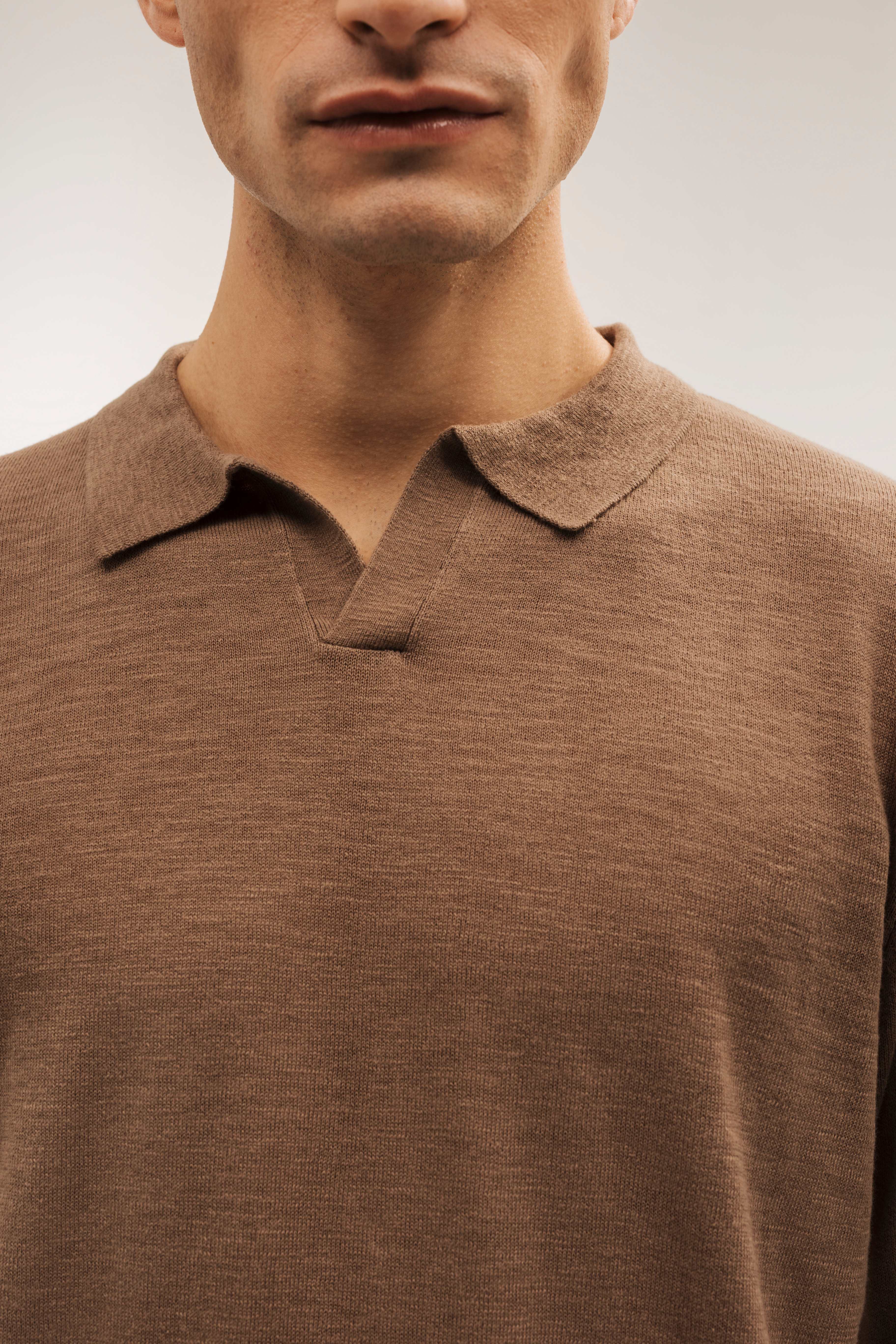 Flame-colored polo neck sweater