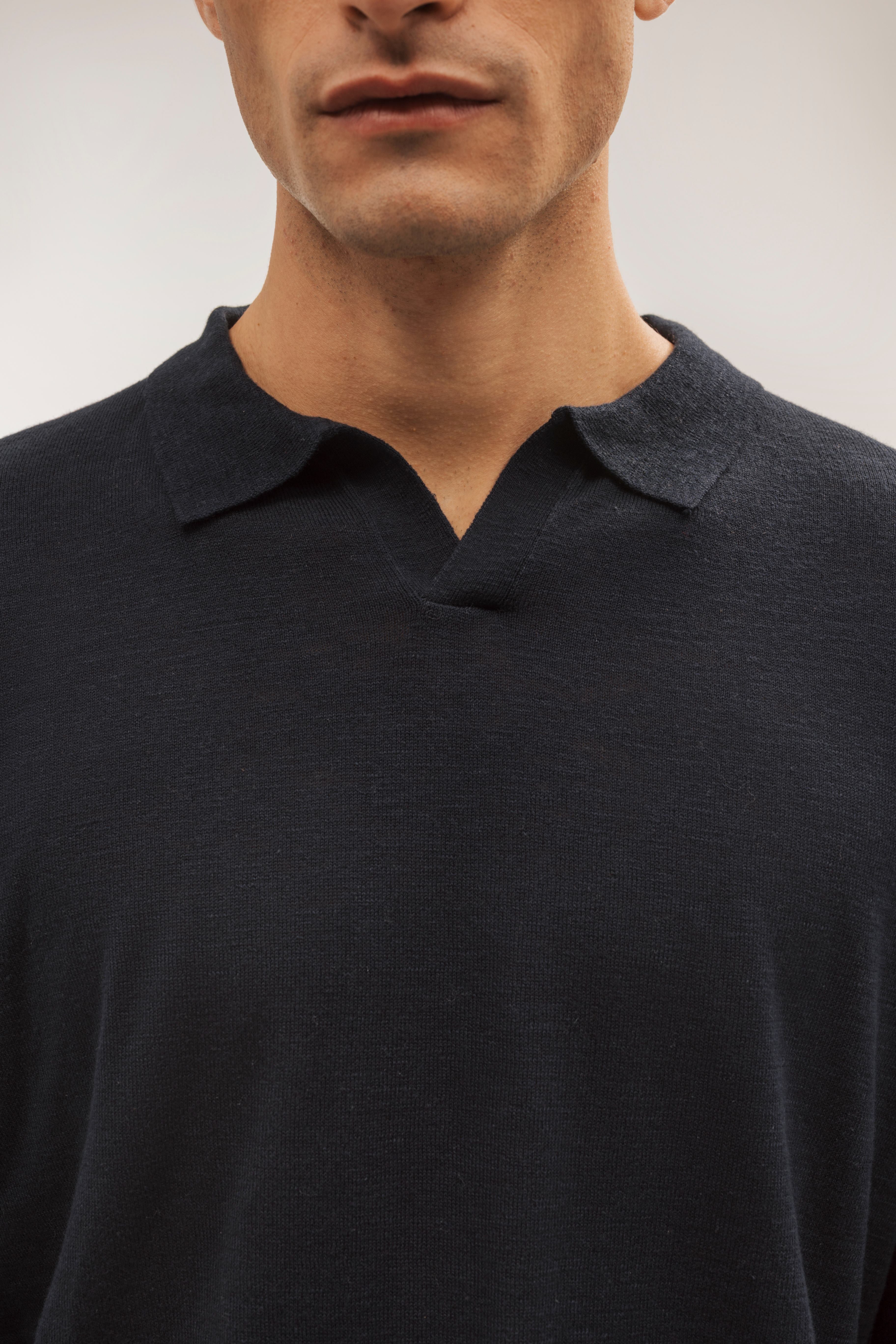 Flame-colored polo neck sweater