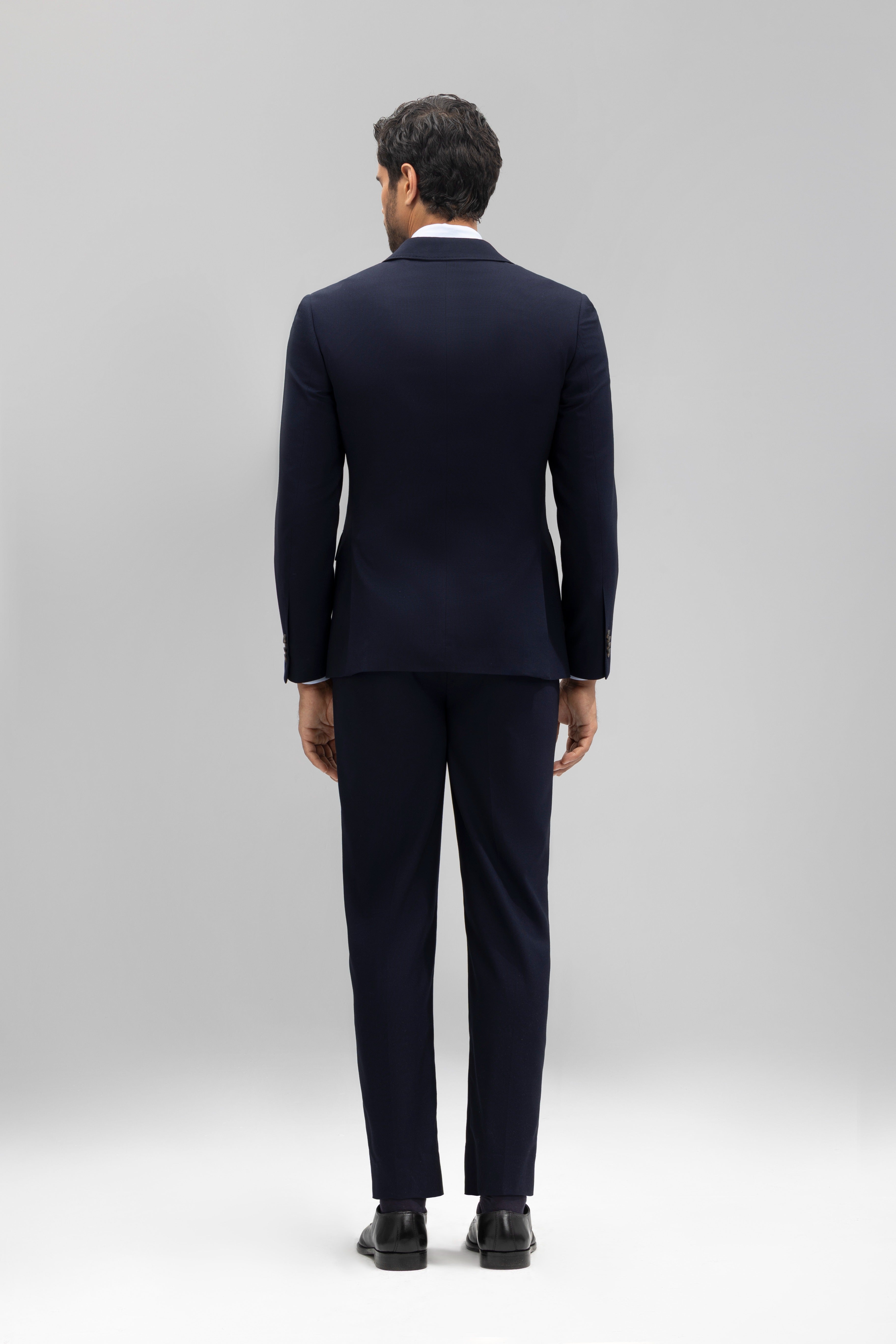 Pantalón traje slim fit falso liso
