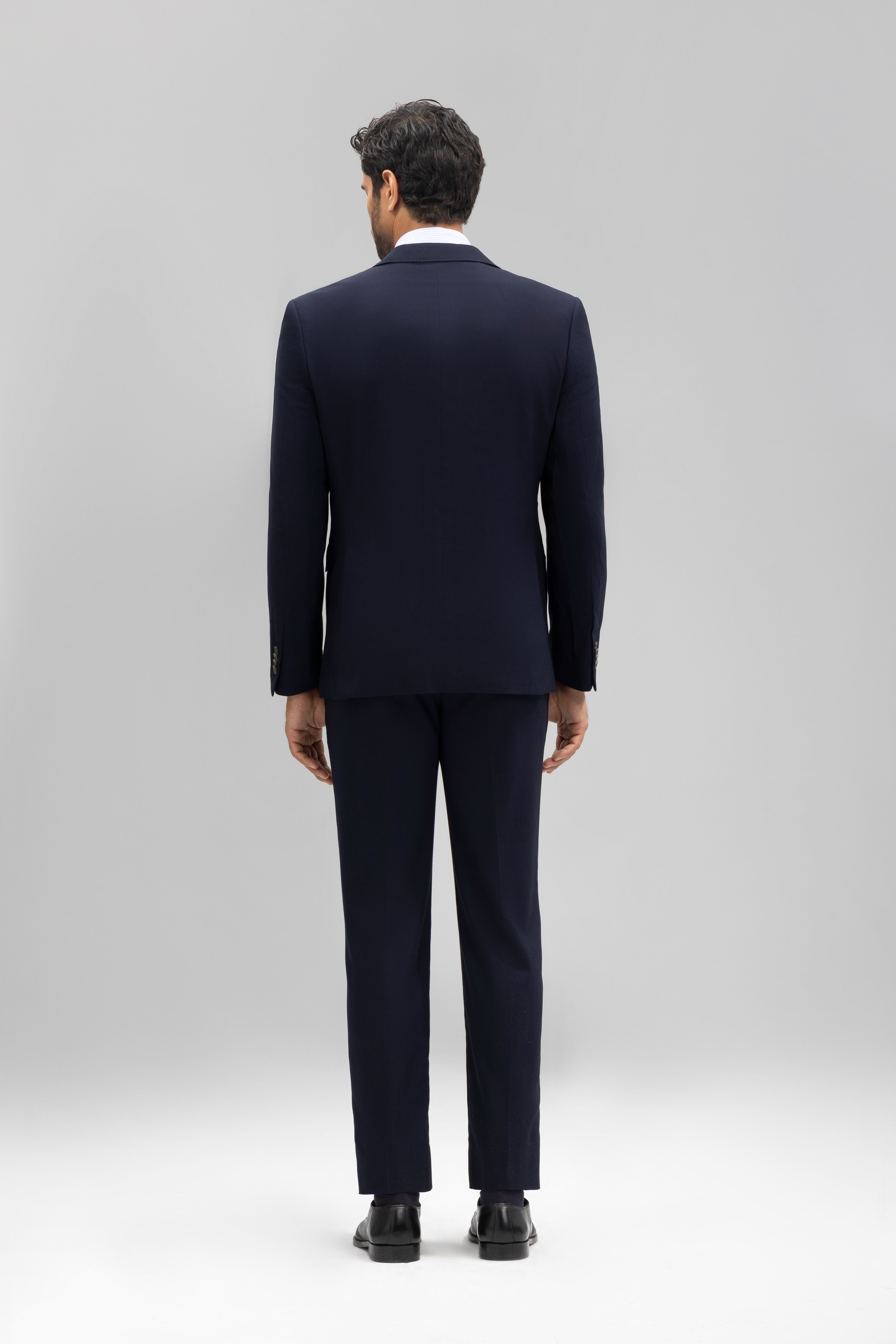 Pantalón traje slim fit falso liso