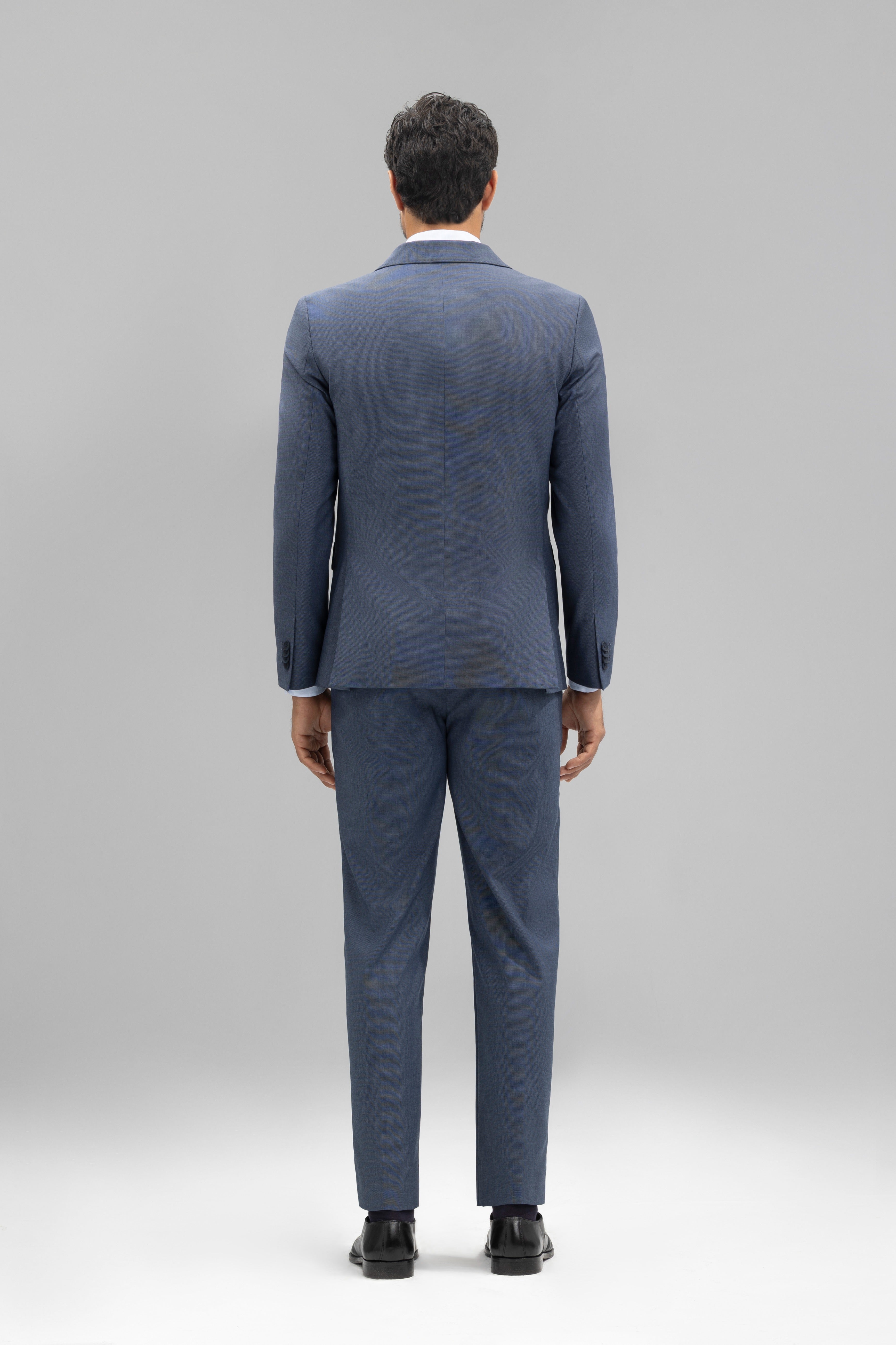 Pantalón traje slim fit falso liso